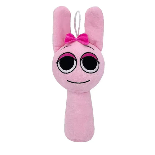 Pink plush toy with bunny ears and bow on a white background