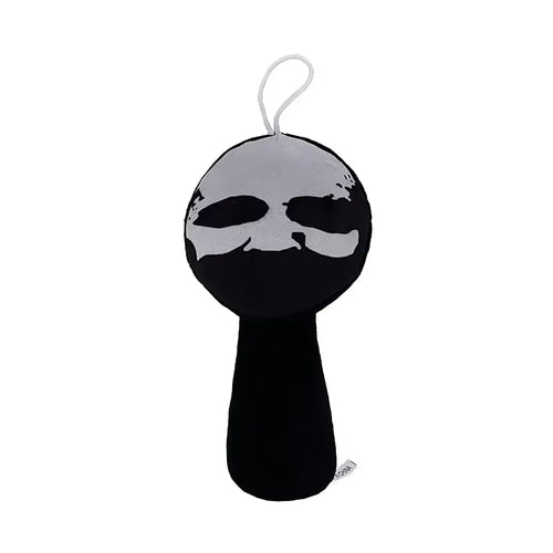 Black and white plush toy with a face on a white background