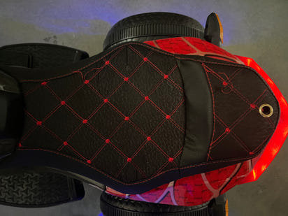 Black and red toy motorcycle on a indoor background