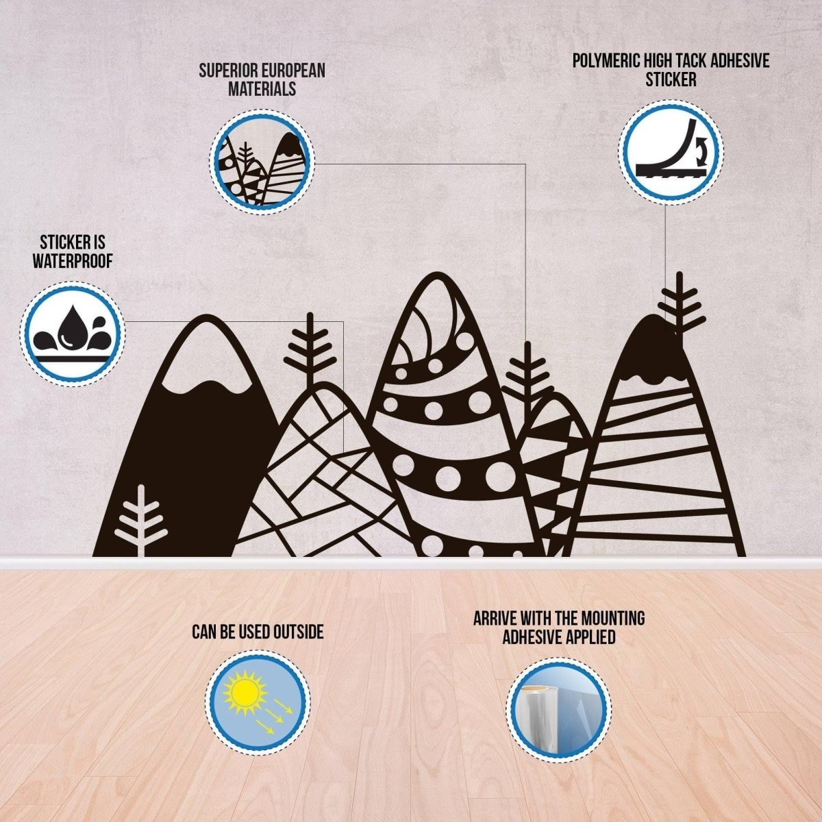Mountain and tree vinyl wall sticker with adhesive information on a wooden surface