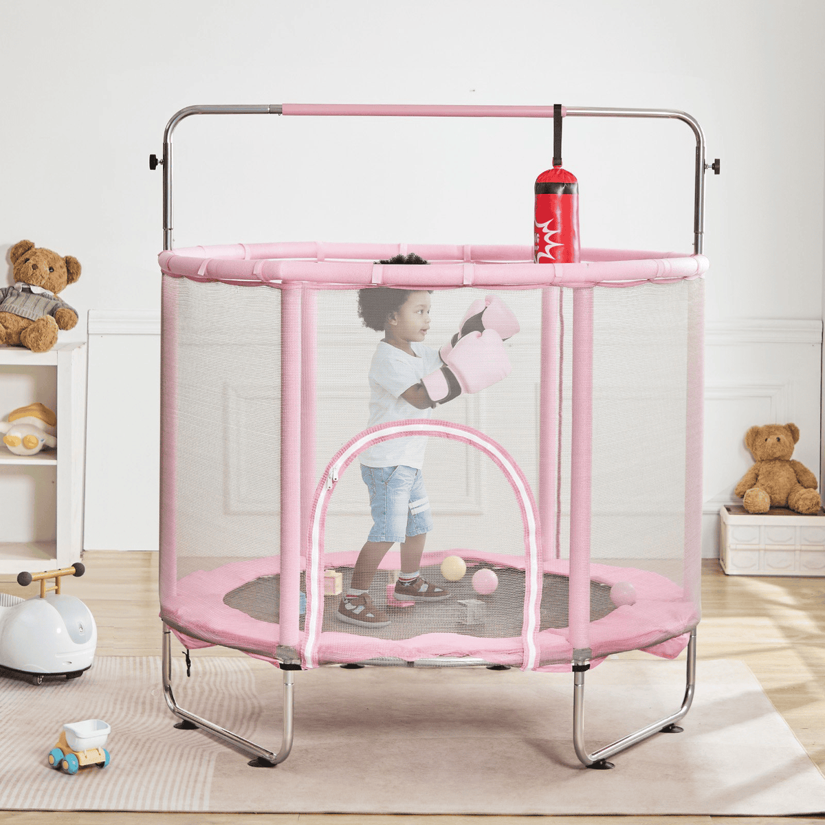 Pink enclosed trampoline with overhead bar and hanging punching bag