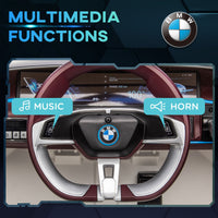 Steering wheel with BMW logo and multimedia functions labeled on a dark background