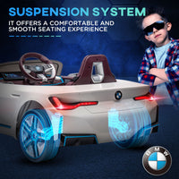 Children's toy car with BMW logo and suspension system text on a dark background