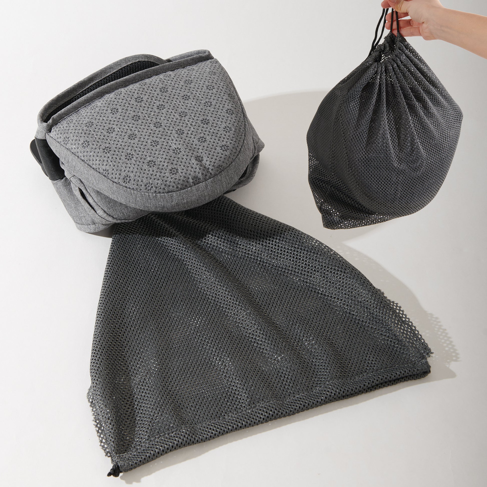 Gray mesh bag with a pattern on a white background