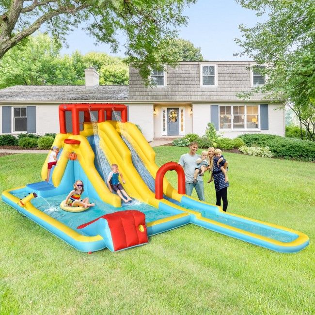 Inflatable water slide with pool in a backyard setting