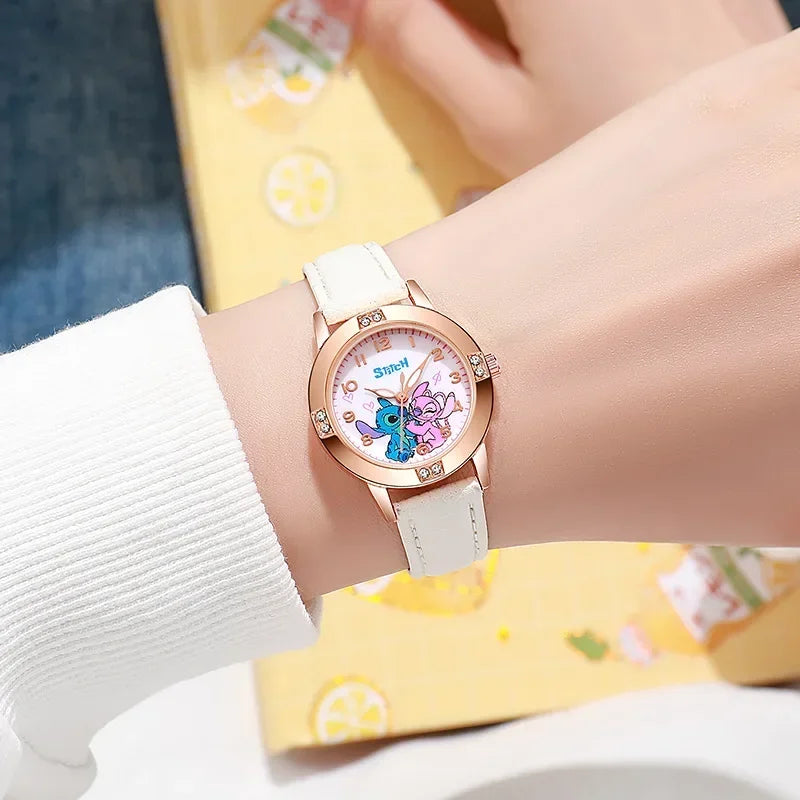 Watch with cartoon character face on a wrist, wearing a white sweater and yellow pants.