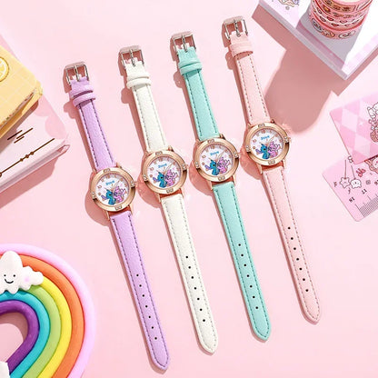 Four colorful children's watches with different strap colors on a pink background.