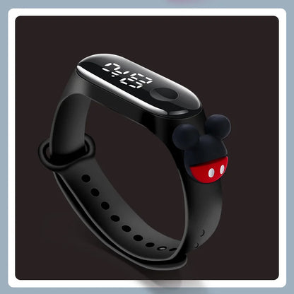 Black digital watch with a cartoon character on a dark background