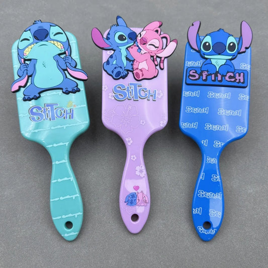Three hairbrushes with cartoon character design on a gray background