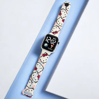 Digital watch with Hello Kitty design on a light blue background