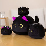 Round black cat plush pillows shown in several sizes