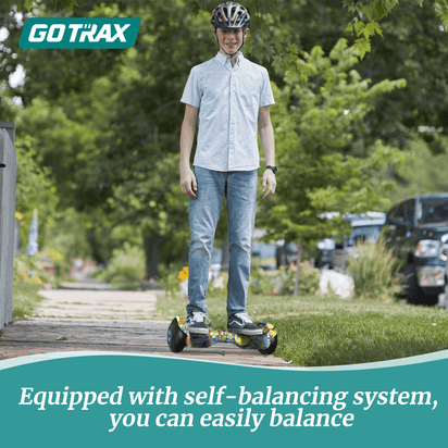 Person using a self-balancing scooter with Gotrax branding in an outdoor setting.