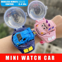 Mini watch car with wireless remote control on a wrist, featuring blue and pink colors.