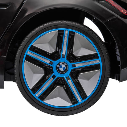Close-up of a BMW wheel with blue accents on a black vehicle.