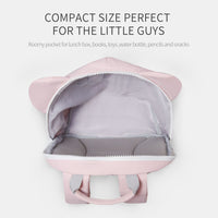 Pink backpack with open compartment on a white background