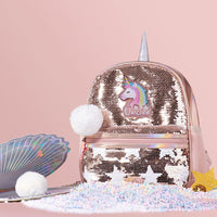 Rose gold sequin bag with unicorn design on a pink background