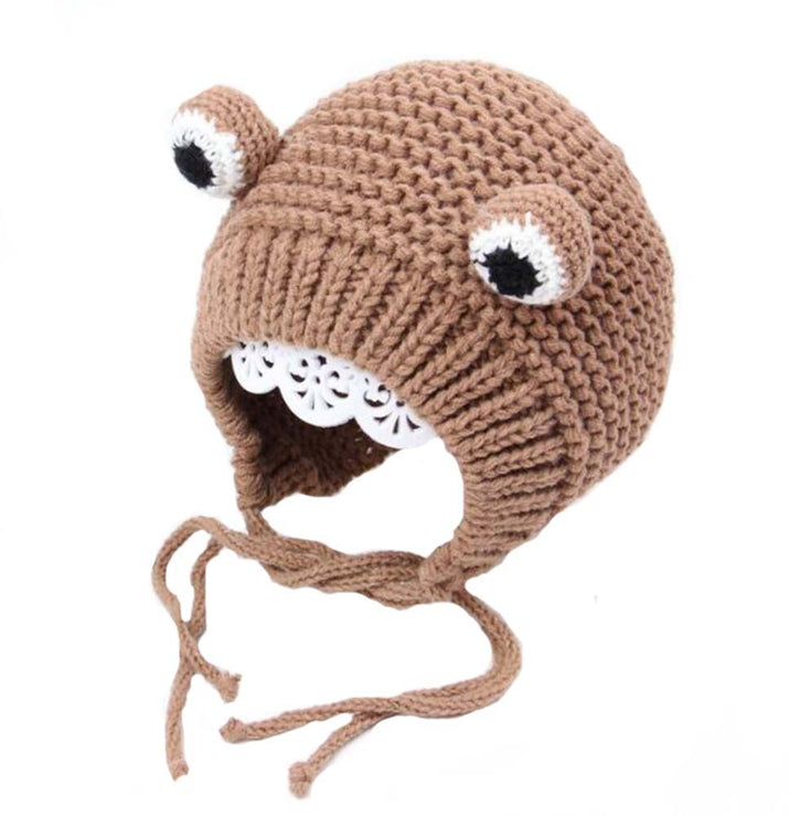 Knitted brown animal hat with white accents on a white background
