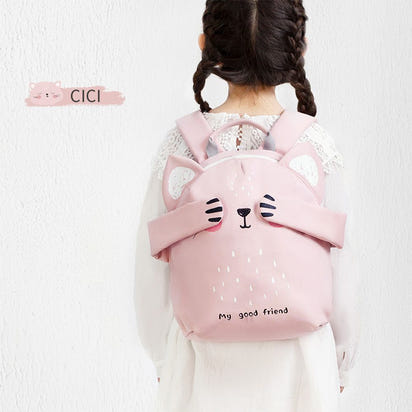 Child wearing a pink backpack with bear ears and face design on a white background