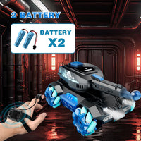 Toy robot with remote control in a sci-fi setting, featuring two batteries on screen.