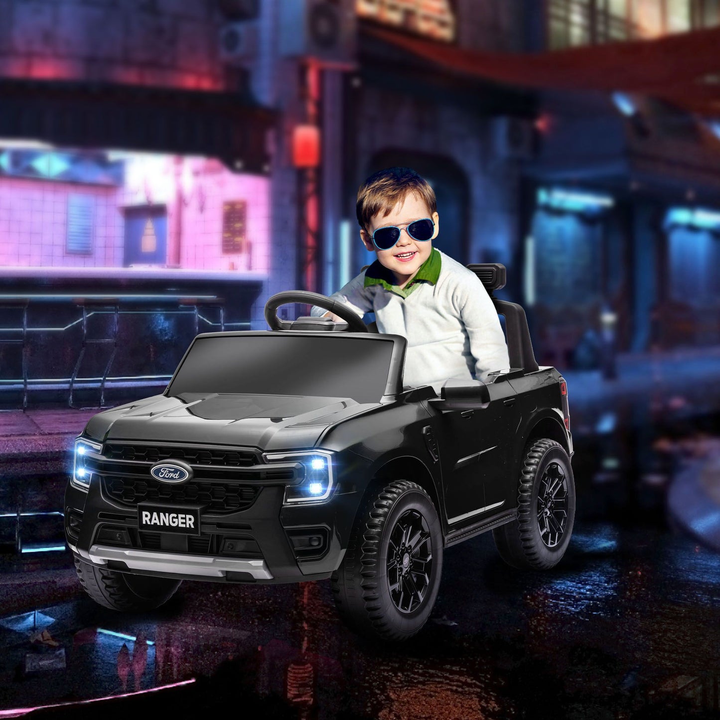 Child in a toy Ford Ranger truck with a cityscape background