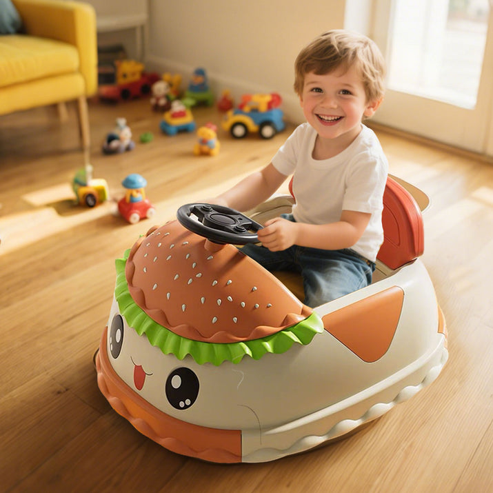 Child playing with a toy car shaped like a hamburger in a room with toys scattered around.