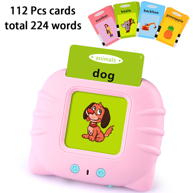 Pink educational device with a screen displaying a dog illustration, surrounded by flashcards.
