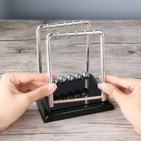 Newton's Cradle: The Art of Perpetual Motion - The Little Big Store